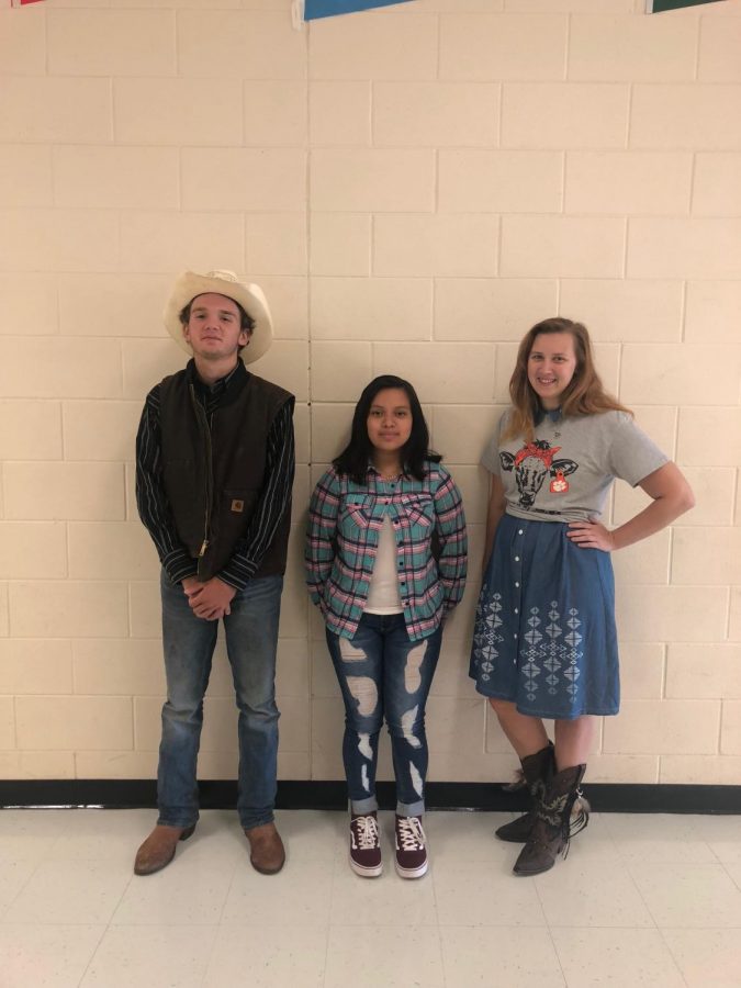 Teacher Erika and her two freshmen students Howard Case and Elida Manuel wearing there Western gear for Spirit Week.