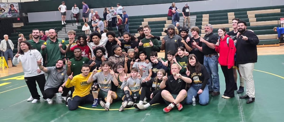 The 2025 wrestlers celebrate after becoming Upper State Champions for the first time in school history. 